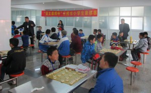 Students challenging one another at the Asia Symbol Chinese Chess Competition