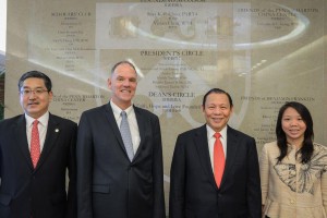 Tanoto Foundation founder Sukanto Tanoto (second from right) and Board of Trustees member Imelda Tanoto (right), pose with the Wharton management to mark the successful launch of the Penn Wharton China Center in Beijing in March 2015.