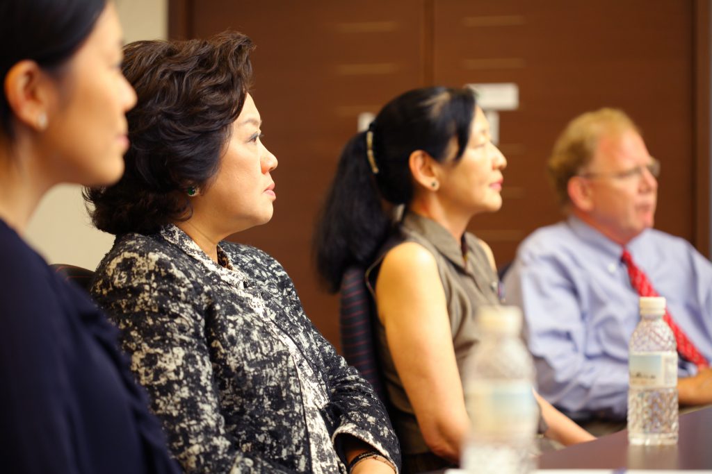 Tanoto Foundation Co-Founder Tinah Bingei Tanoto and Board of Trustees Member Belinda Tanoto listen as SingHealth Duke-NUS professors explain the impact of the gift to catalyse drug and vaccine discovery